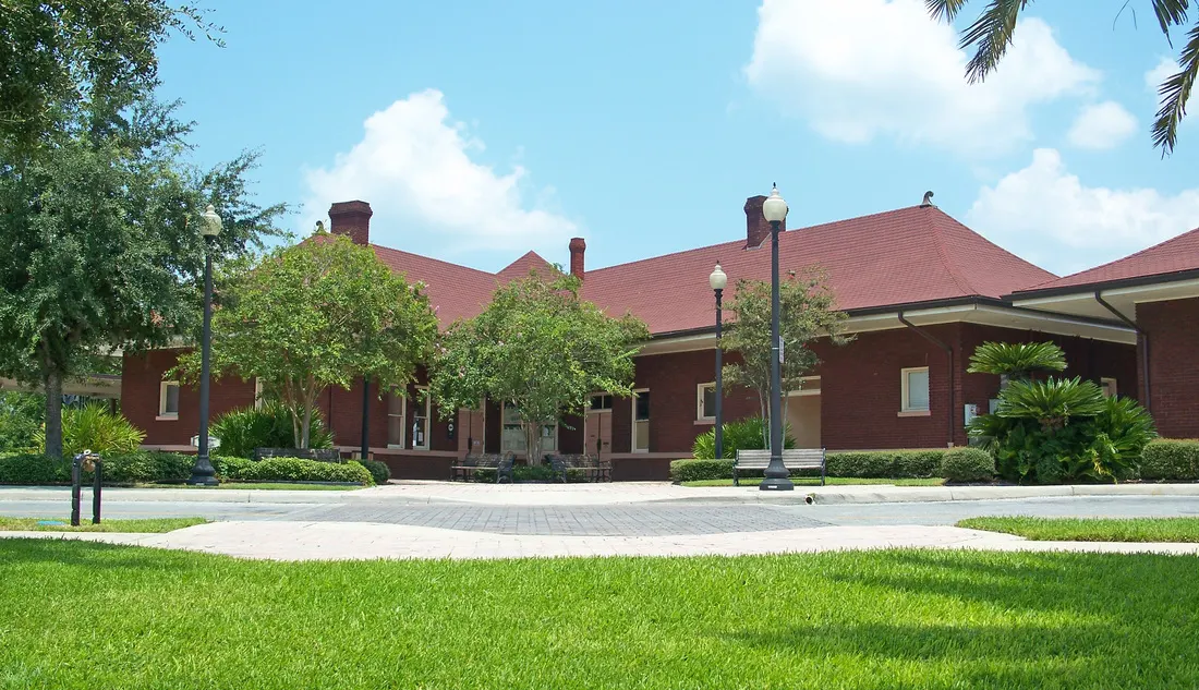 Ocala Union Station, a long red-brick building with hipped roofs, on a sunny day